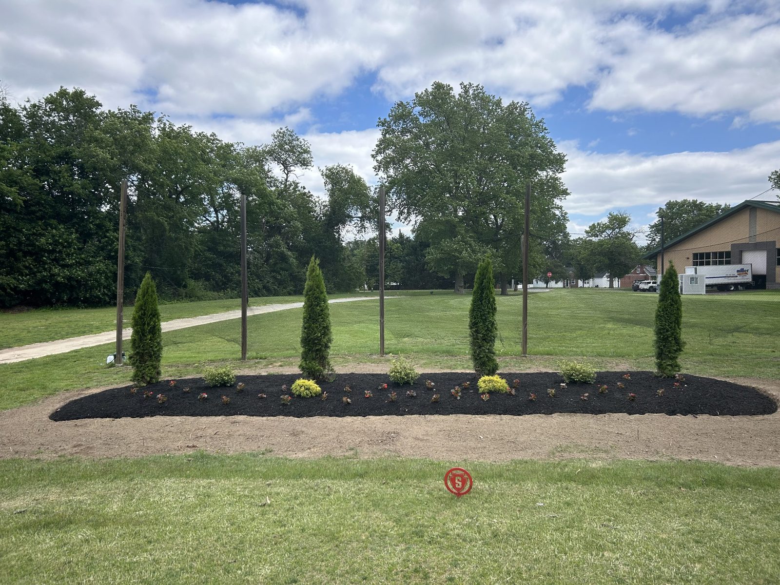 Manicured lawn with shaped landscape beds